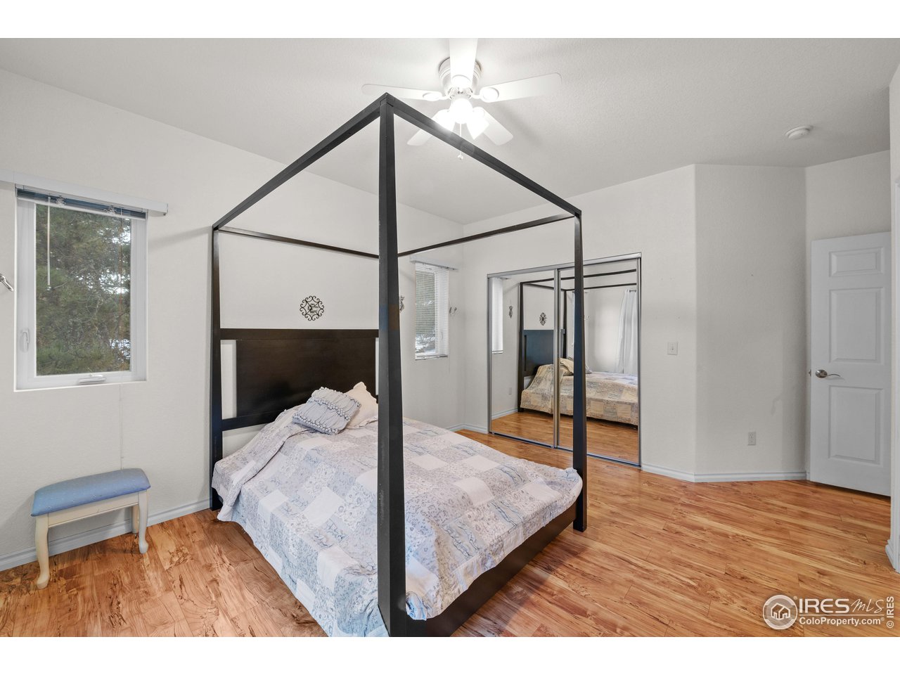 339 Cedar Drive Lyons, CO 80540 - Photo 27 of 37 a bedroom with a bed window and walk in closet