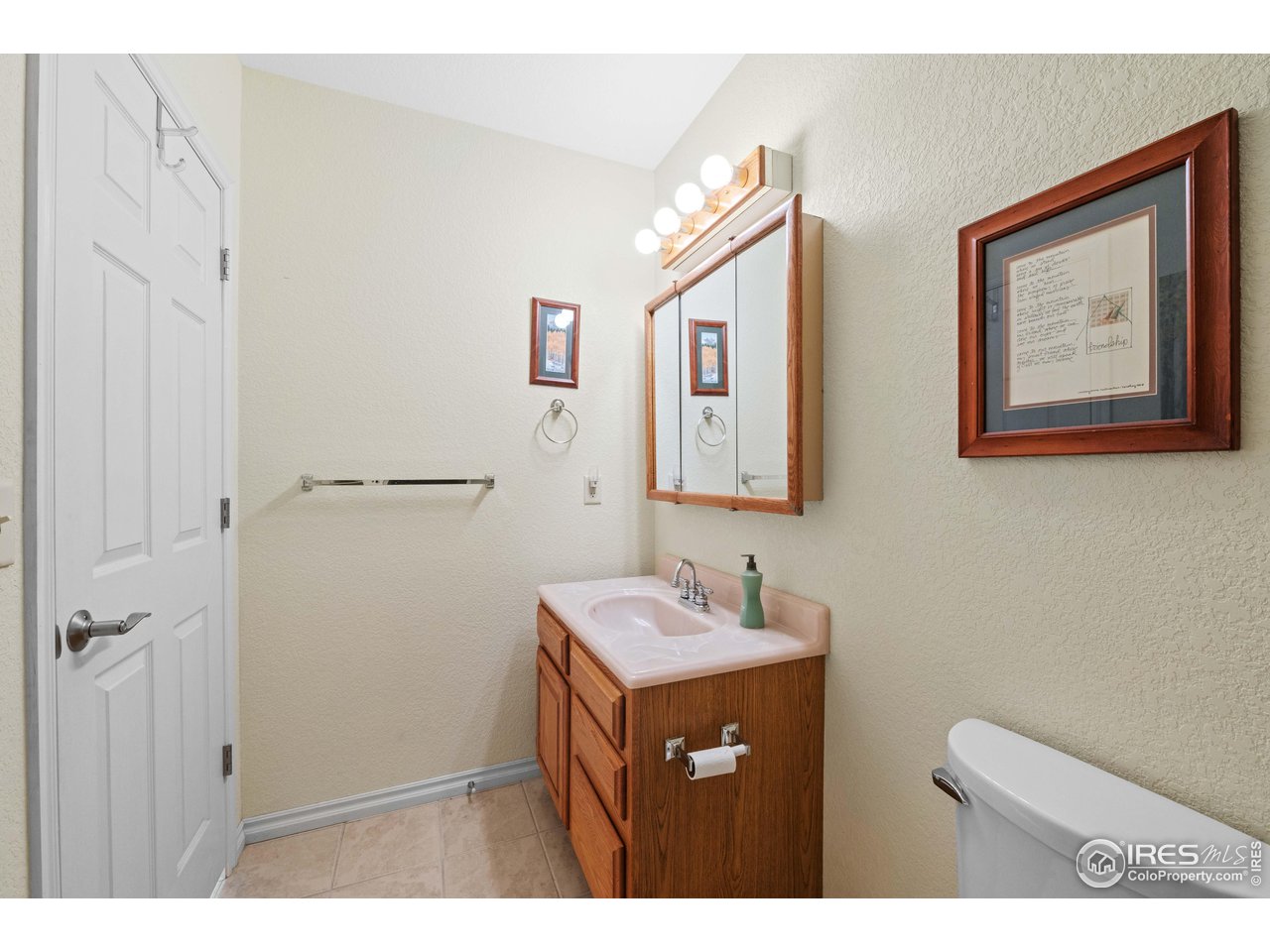 339 Cedar Drive Lyons, CO 80540 - Photo 29 of 37 a bathroom with a sink mirror and vanity