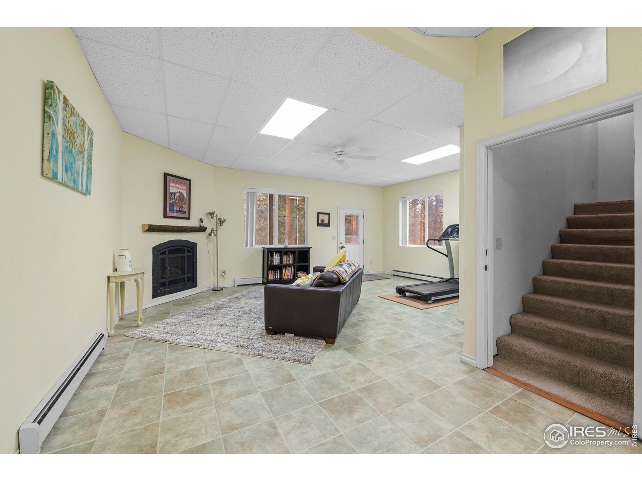 339 Cedar Drive Lyons, CO 80540 - Photo 32 of 37 a living room with furniture and a fireplace