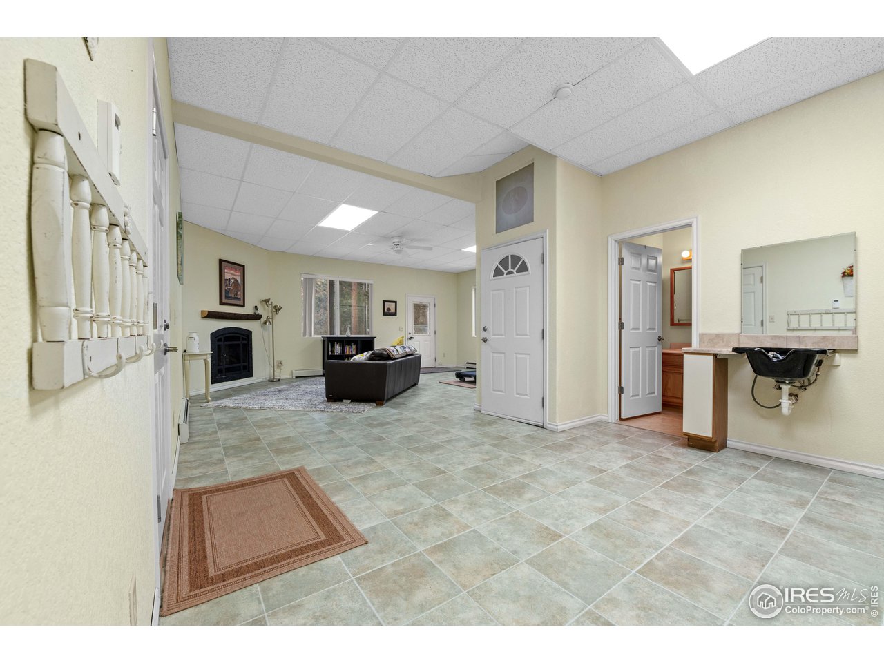 339 Cedar Drive Lyons, CO 80540 - Photo 8 of 37 a view of open kitchen with furniture and a refrigerator