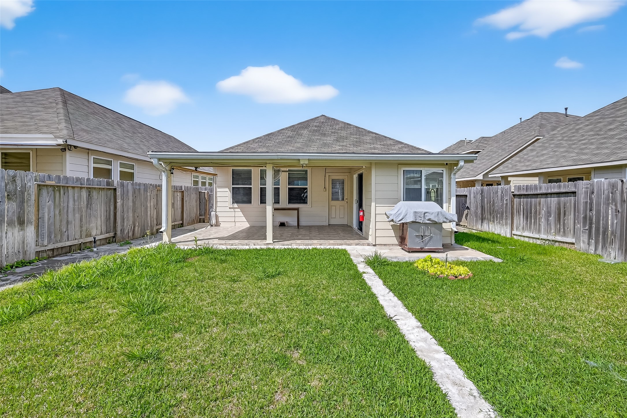 7631 Granite Terrace Lane Houston, TX 77083 - Photo 45 of 46 a front view of house with yard patio and green space