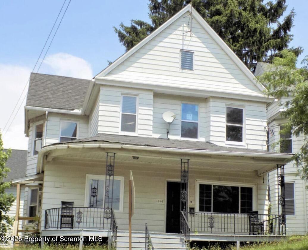 a front view of a house with glass windows
