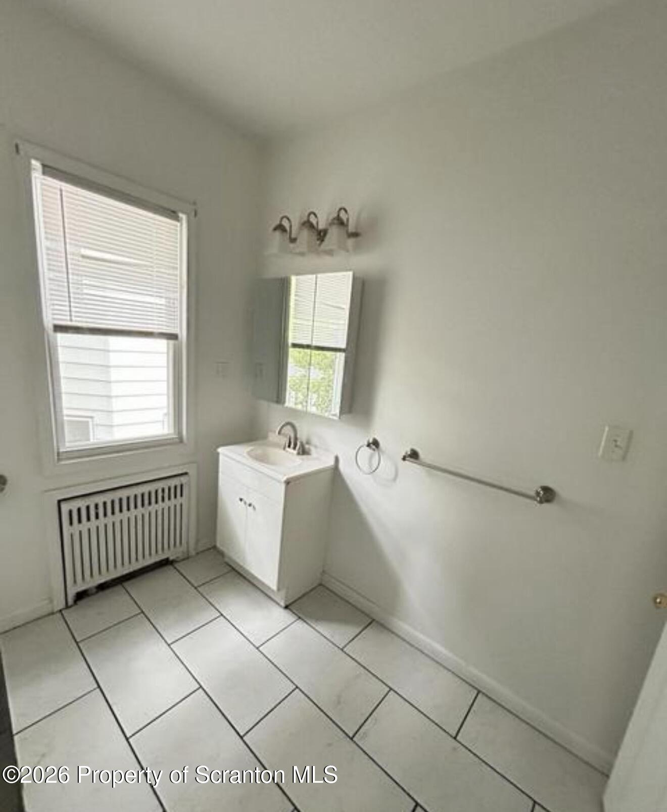 1607 Mulberry Street Scranton, PA 18510 - Photo 11 of 12 a bathroom with a sink toilet and tub