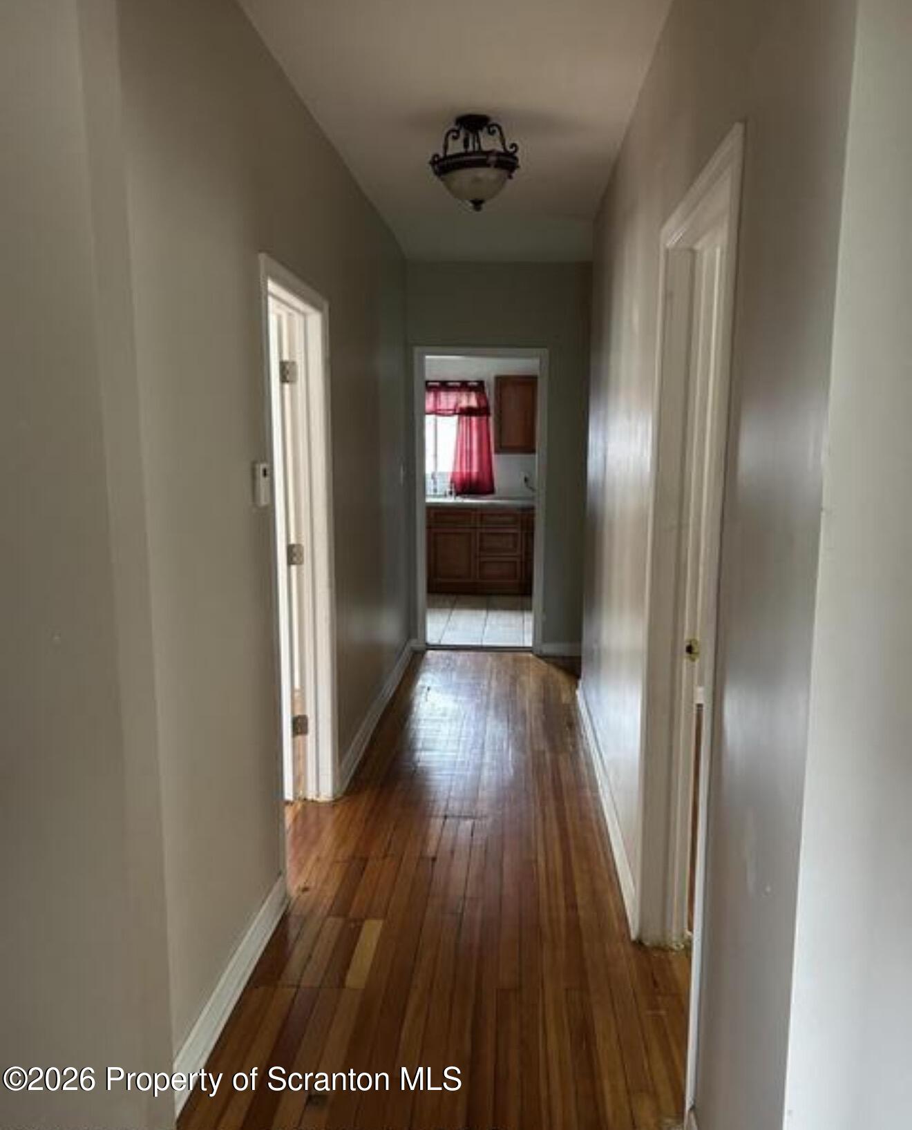 1607 Mulberry Street Scranton, PA 18510 - Photo 4 of 12 a view of a hallway with wooden floor