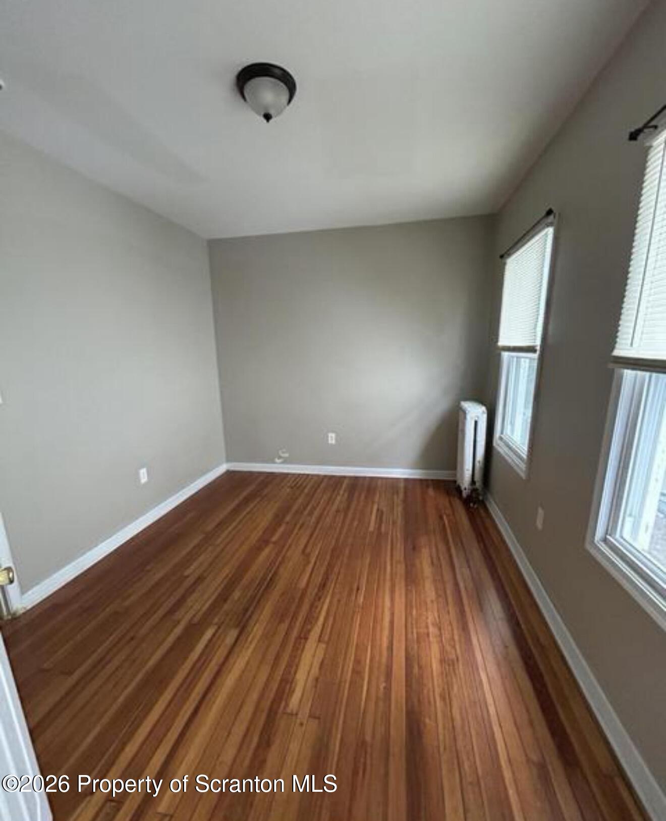 1607 Mulberry Street Scranton, PA 18510 - Photo 5 of 12 a view of wooden floor in an empty room