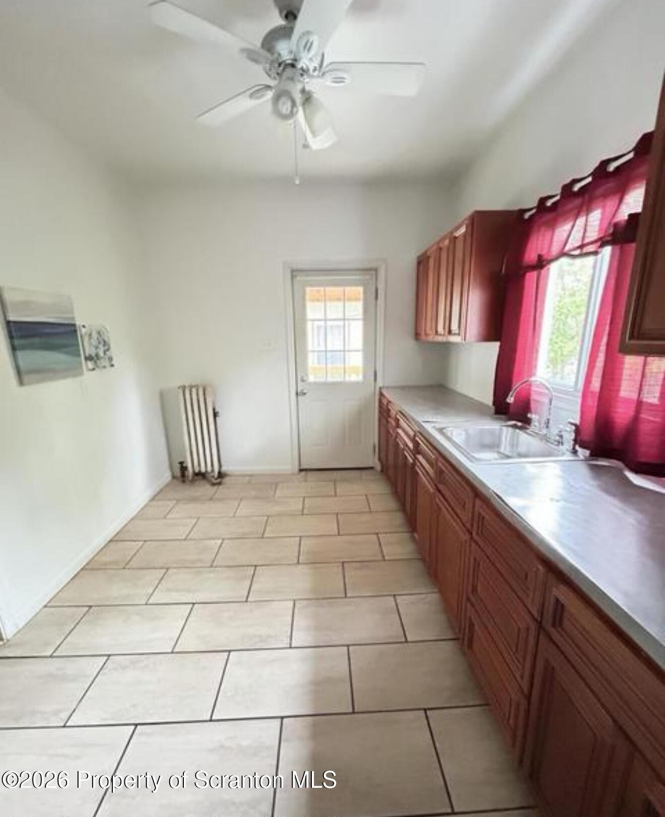 1607 Mulberry Street Scranton, PA 18510 - Photo 9 of 12 a spacious bathroom with a granite countertop sink a mirror and bathtub