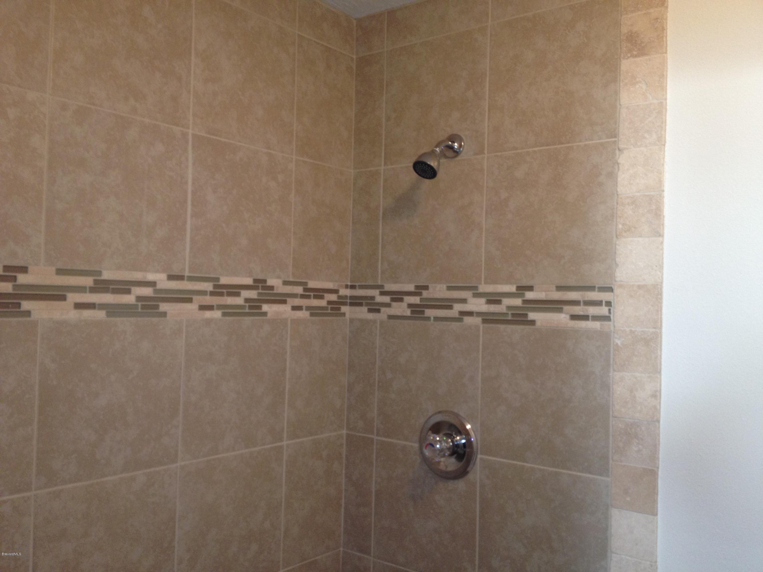 385 Rheine Road Northwest Palm Bay, FL 32907 - Photo 11 of 15 a close view of a shower in bathroom