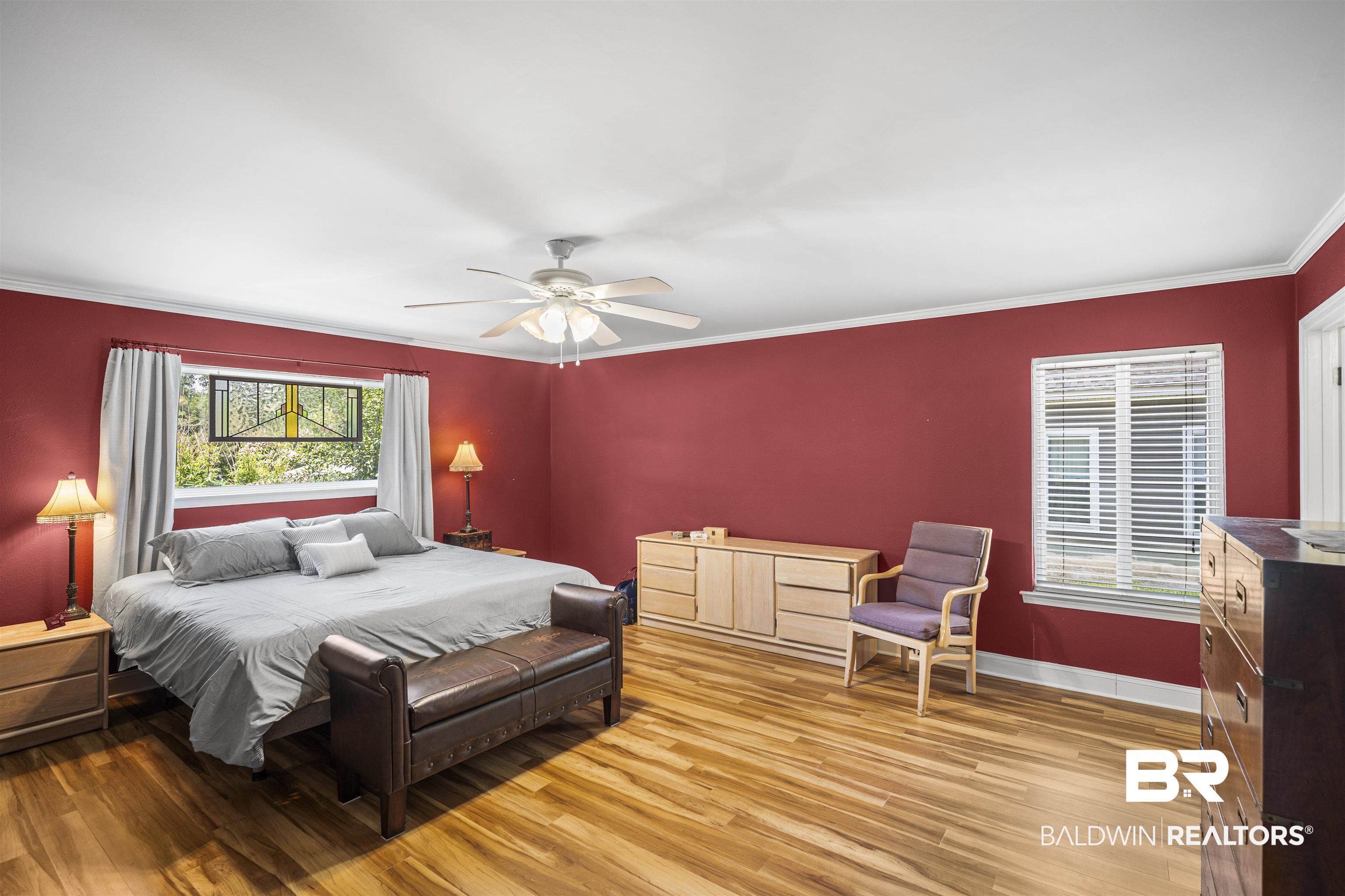1615 5th Street Daphne, AL 36526 - Photo 15 of 28 Bright room featuring wood-finish flooring, a ceiling fan with integrated lighting, and multiple windows