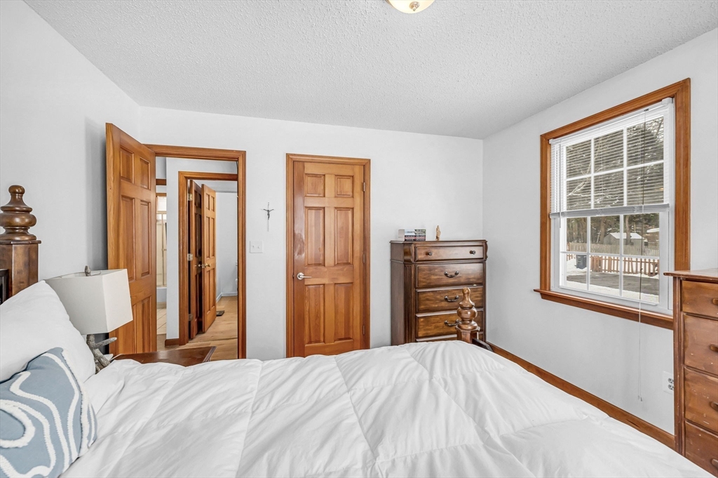 365 Maple Road Longmeadow, MA 01106 - Photo 13 of 32 a bedroom with a bed and furniture with a flat tv screen