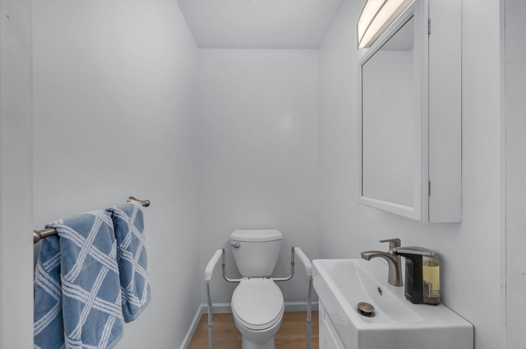 365 Maple Road Longmeadow, MA 01106 - Photo 16 of 32 a bathroom with a toilet sink and mirror