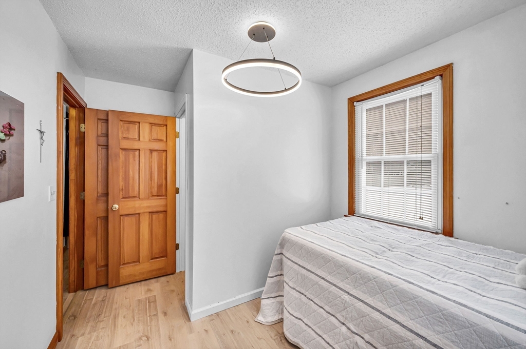365 Maple Road Longmeadow, MA 01106 - Photo 20 of 32 a bedroom with a bed and a window
