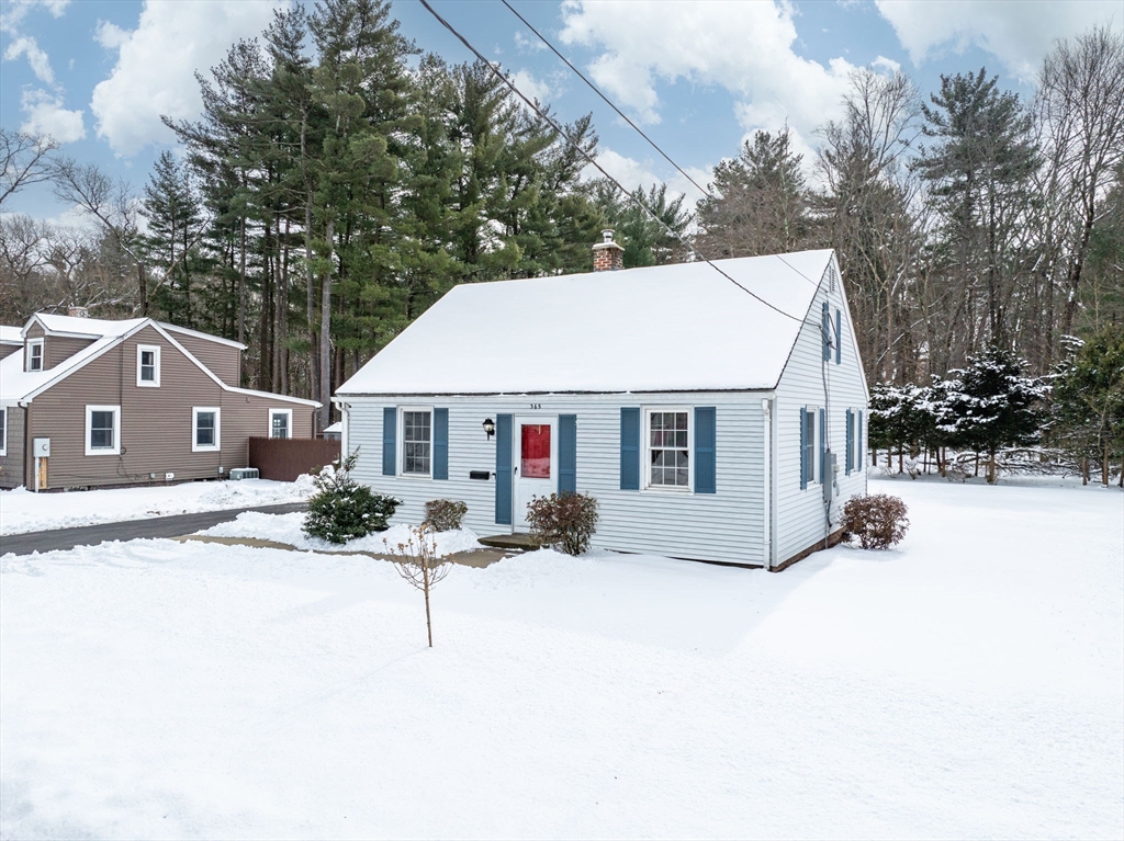 365 Maple Road Longmeadow, MA 01106 - Photo 2 of 32 a view of a house with a yard covered in snow