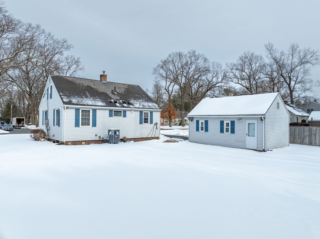 365 Maple Road Longmeadow, MA 01106 - Photo 24 of 32 a front view of a house with a yard and garage