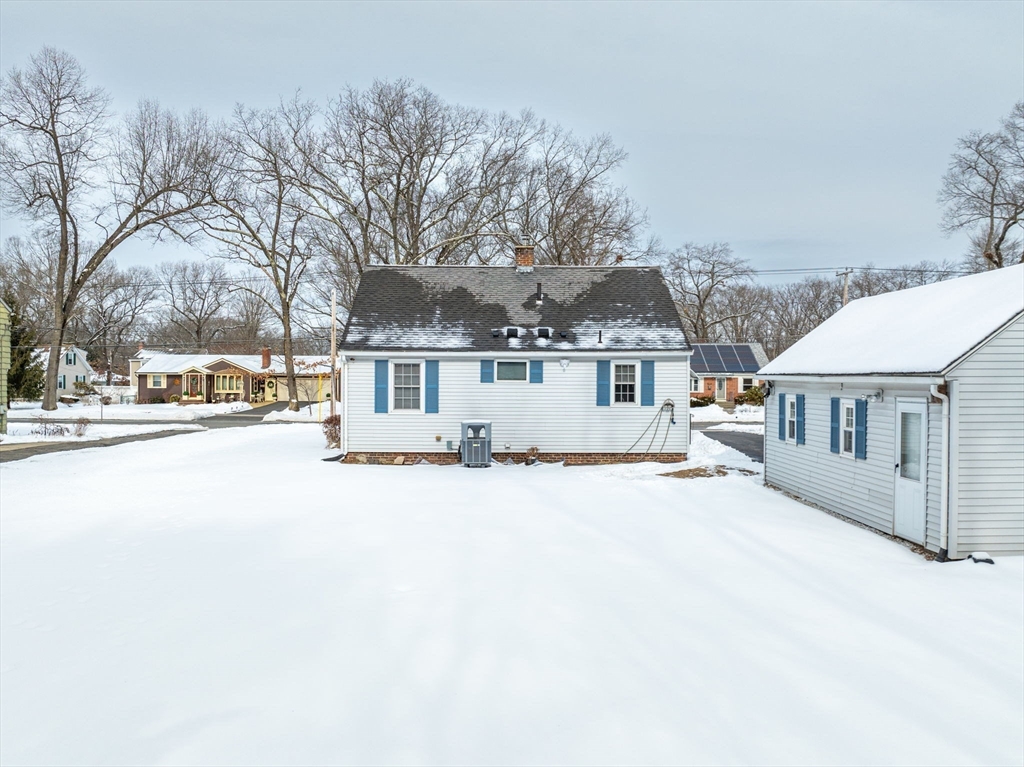 365 Maple Road Longmeadow, MA 01106 - Photo 25 of 32 front view of a house with a snow on the road