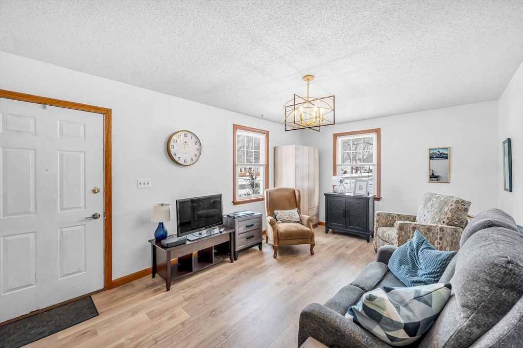 365 Maple Road Longmeadow, MA 01106 - Photo 3 of 32 a living room with furniture a fireplace and a window