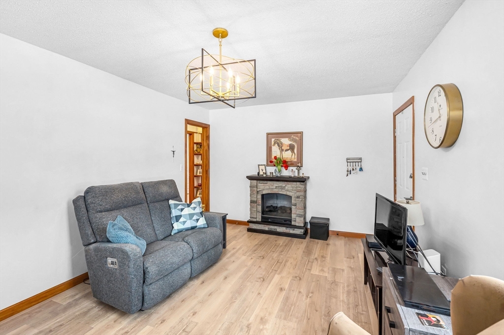 365 Maple Road Longmeadow, MA 01106 - Photo 5 of 32 a living room with furniture and a flat screen tv