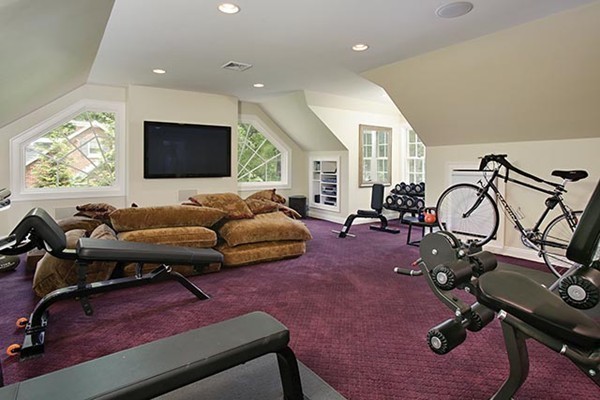 15 Bonad Road Newton, MA 02465 - Photo 12 of 16 a living room with furniture gym equipment and a flat screen tv