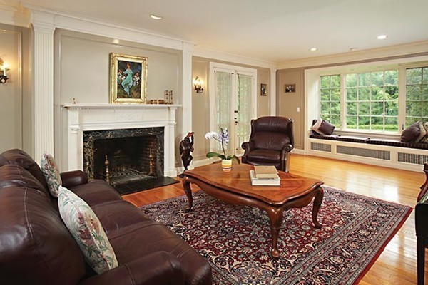 15 Bonad Road Newton, MA 02465 - Photo 4 of 16 a living room with furniture and a fireplace