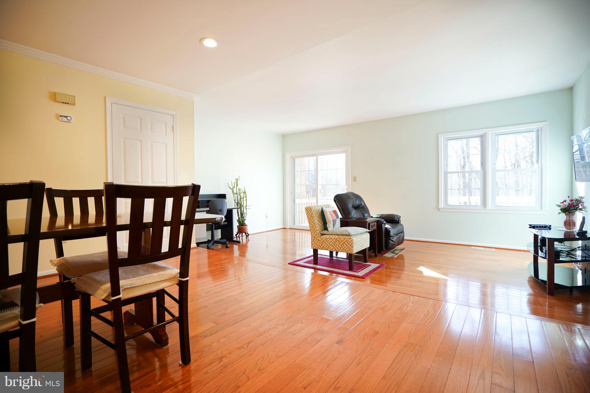8836 Surveyors Place Springfield, VA 22152 - Photo 11 of 48 a living room with furniture and a wooden floor