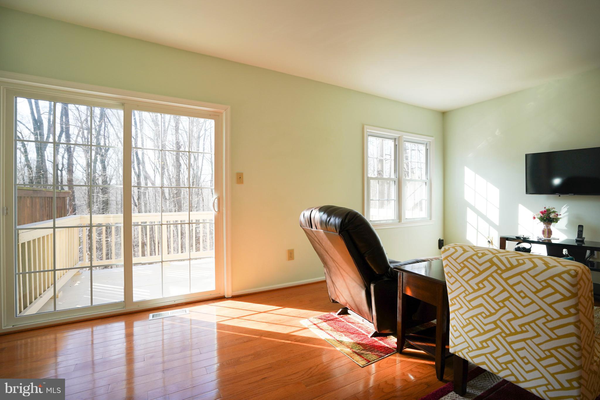 8836 Surveyors Place Springfield, VA 22152 - Photo 15 of 48 a view of a workspace with furniture and a window