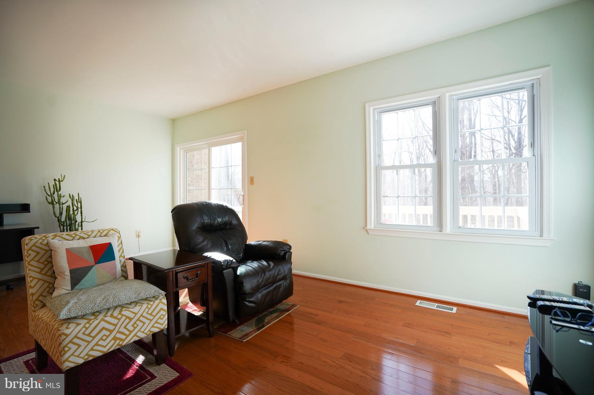 8836 Surveyors Place Springfield, VA 22152 - Photo 16 of 48 a living room with furniture and a window