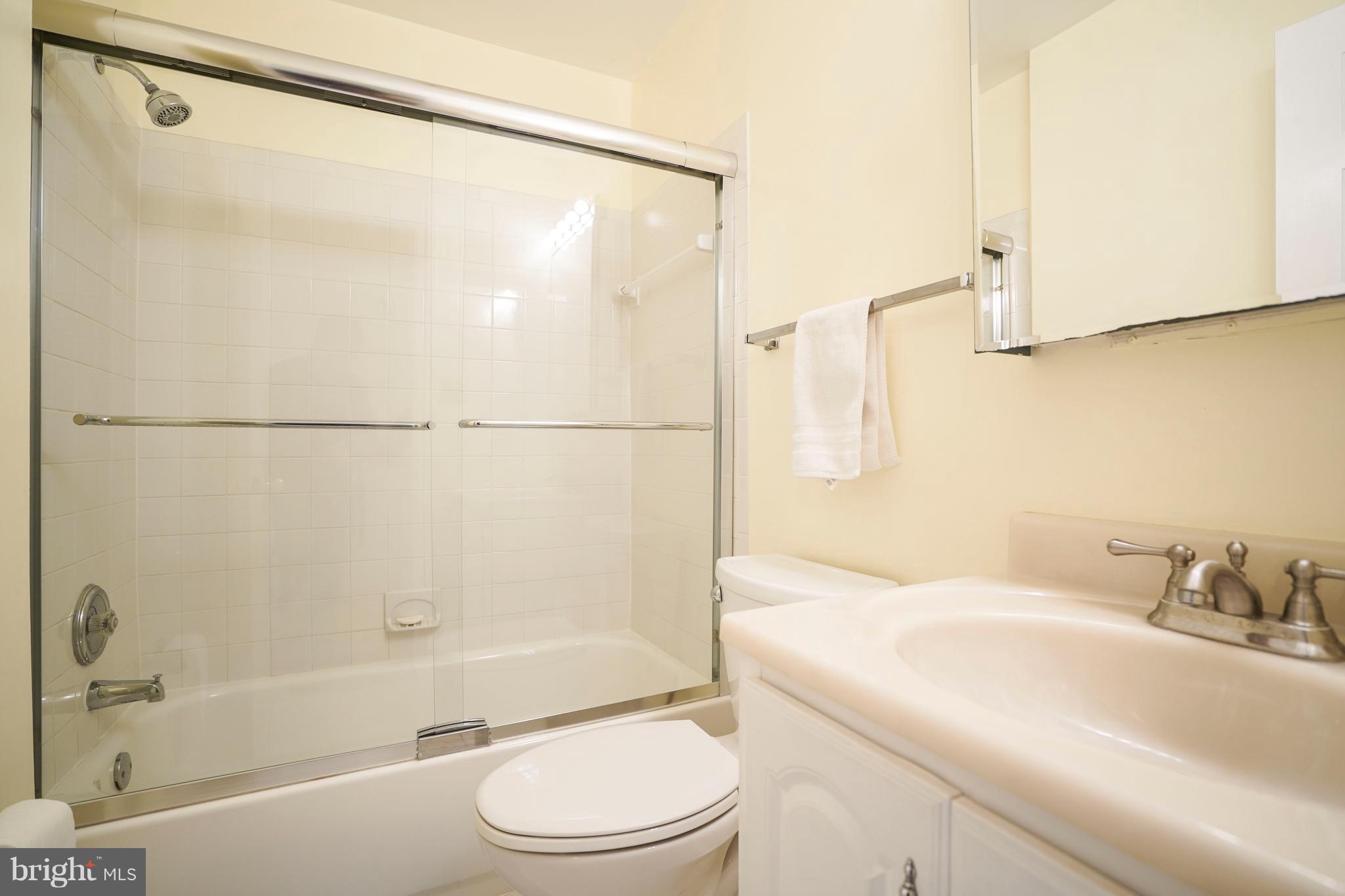 8836 Surveyors Place Springfield, VA 22152 - Photo 29 of 48 a bathroom with a sink toilet and shower