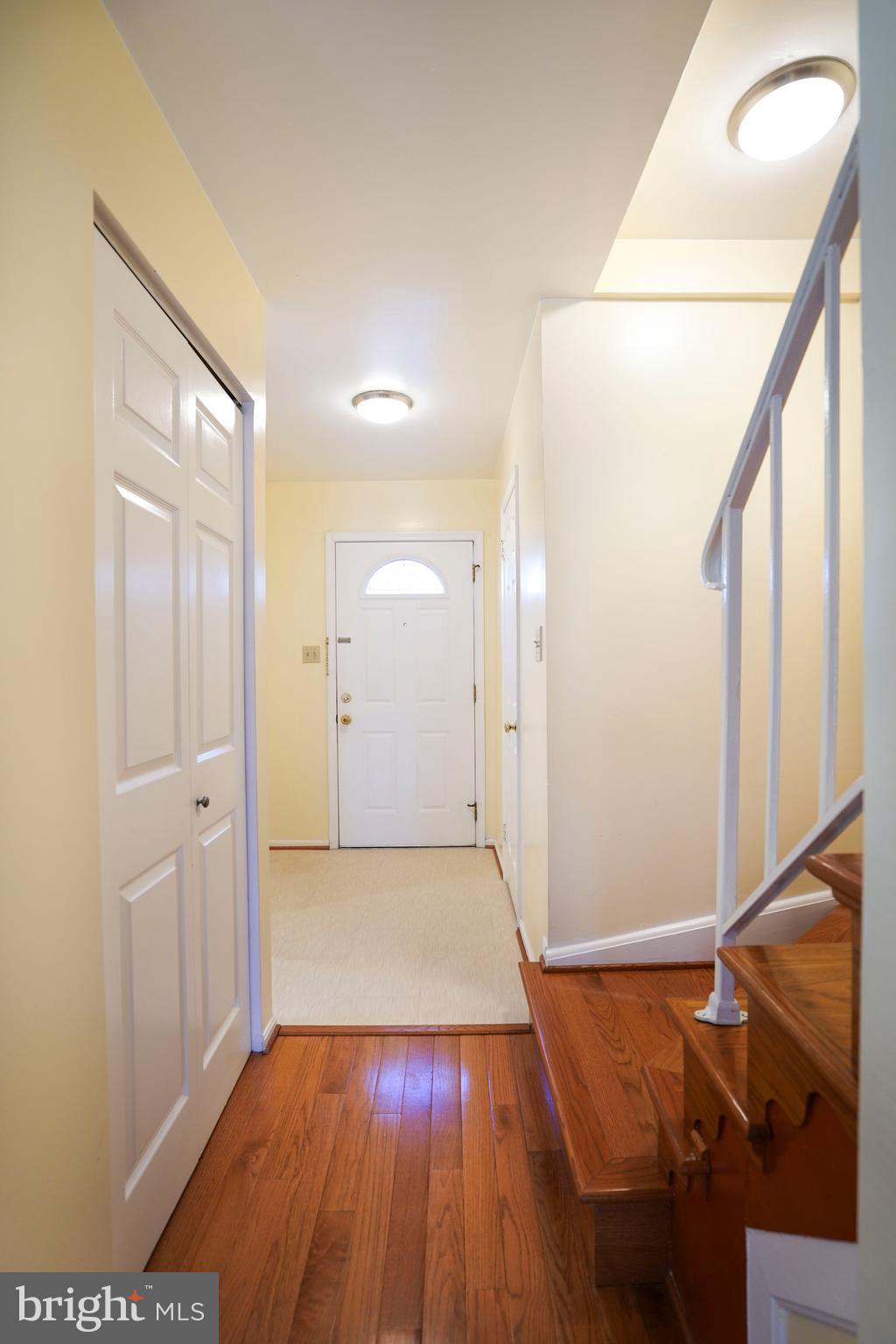 8836 Surveyors Place Springfield, VA 22152 - Photo 4 of 48 a view of an empty room with wooden floor and a window