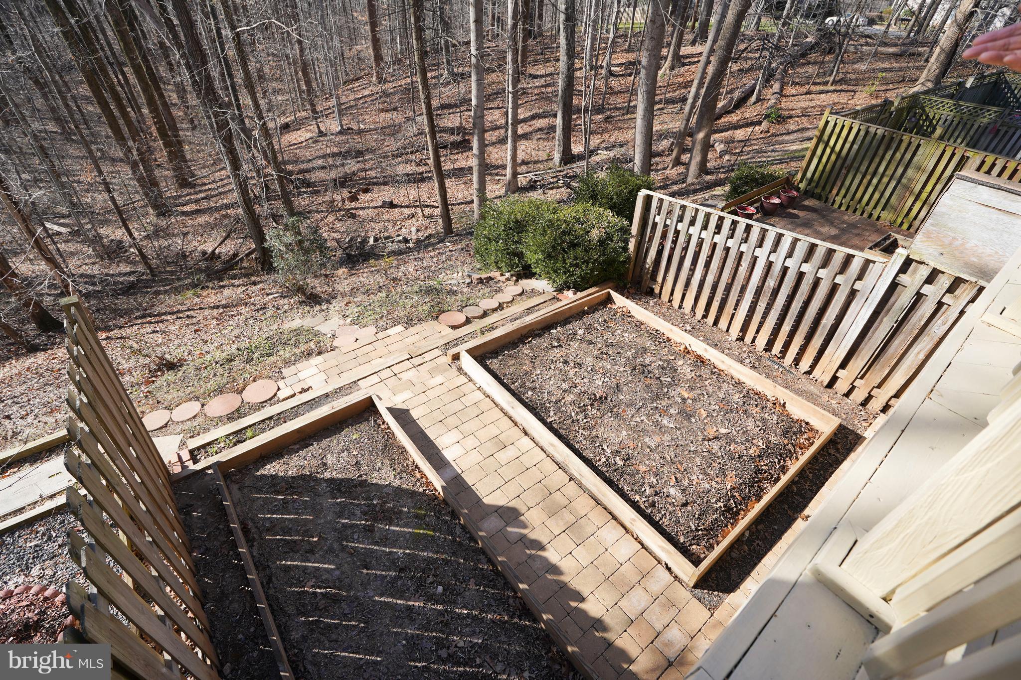 8836 Surveyors Place Springfield, VA 22152 - Photo 36 of 48 a view of a backyard with wooden fence