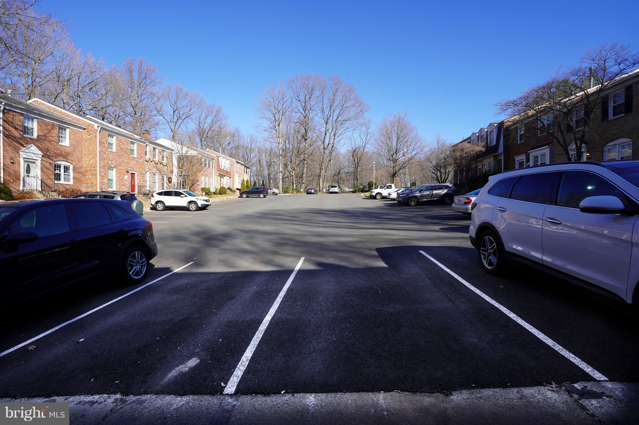 8836 Surveyors Place Springfield, VA 22152 - Photo 40 of 48 a view of a city street with a car parked on the roadside