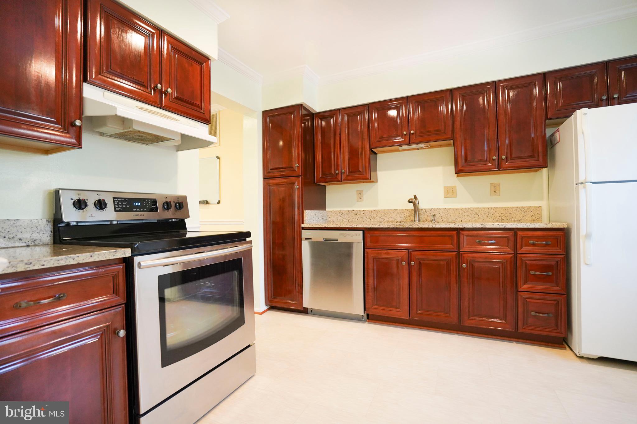 8836 Surveyors Place Springfield, VA 22152 - Photo 5 of 48 a kitchen with stainless steel appliances granite countertop a refrigerator a oven a sink and dishwasher