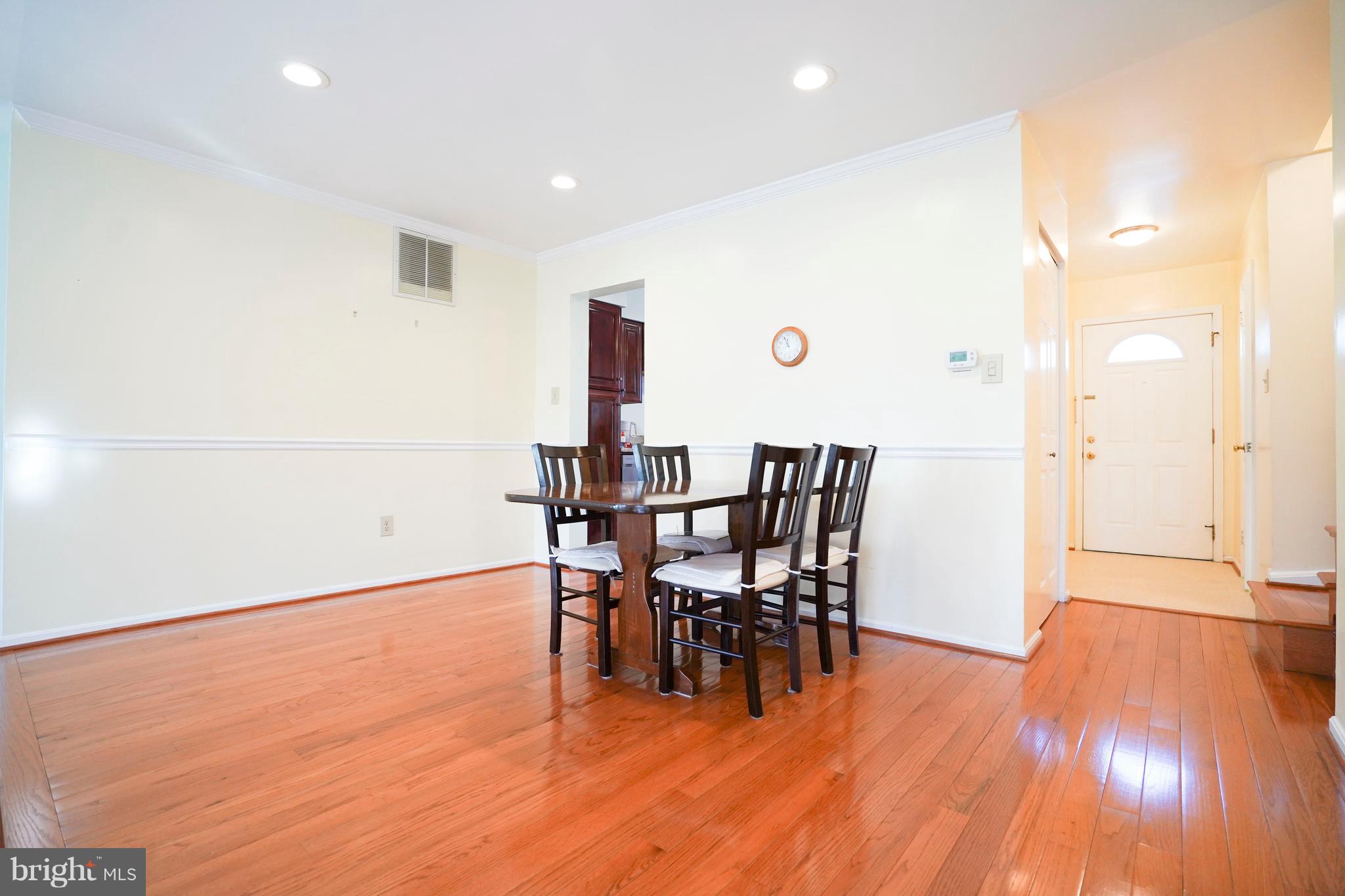 8836 Surveyors Place Springfield, VA 22152 - Photo 8 of 48 a view of a dining room with furniture and wooden floor