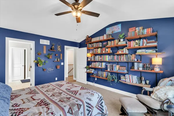 a bedroom with a bed and window