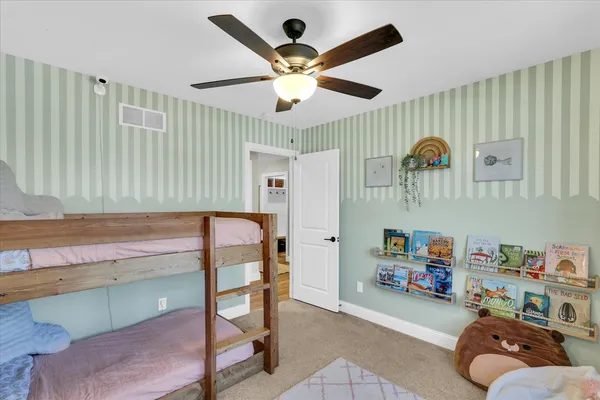 a very nice looking room with a large window and a chandelier