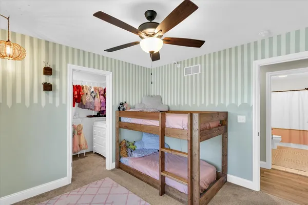 a bedroom with a bed and a table