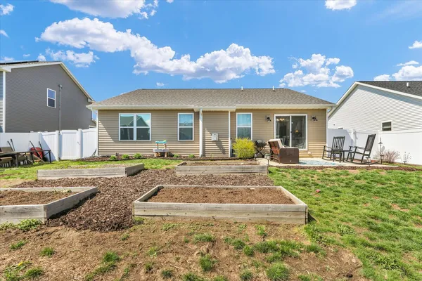 a view of a house with a backyard