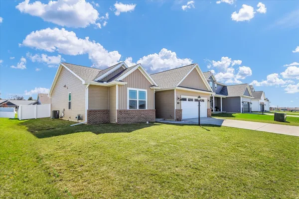a view of a house with a yard