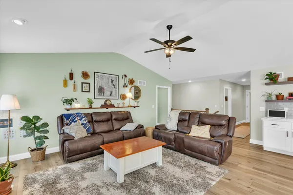 a living room with furniture and a fireplace