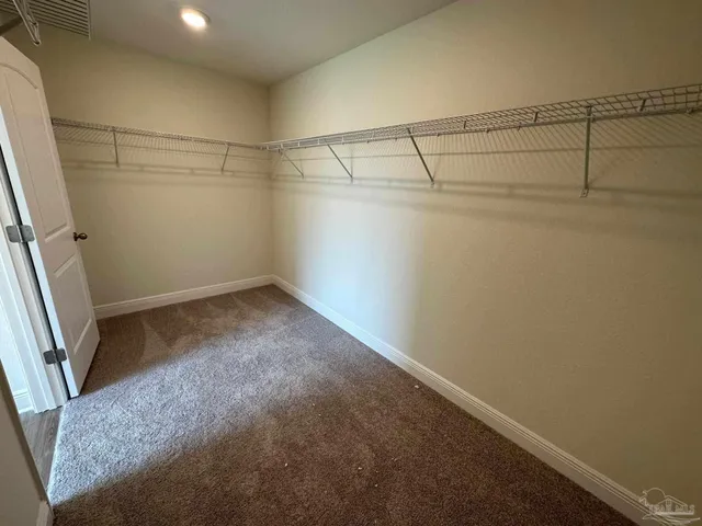 a view of a room with racks on the wall