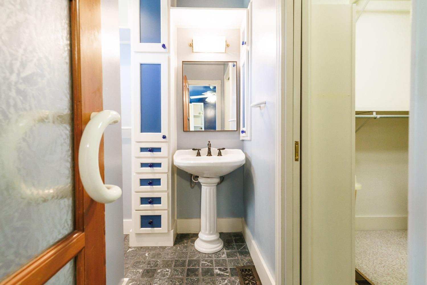 4603 94th Street Lubbock, TX 79424 - Photo 26 of 46 a bathroom with a sink a toilet and shower