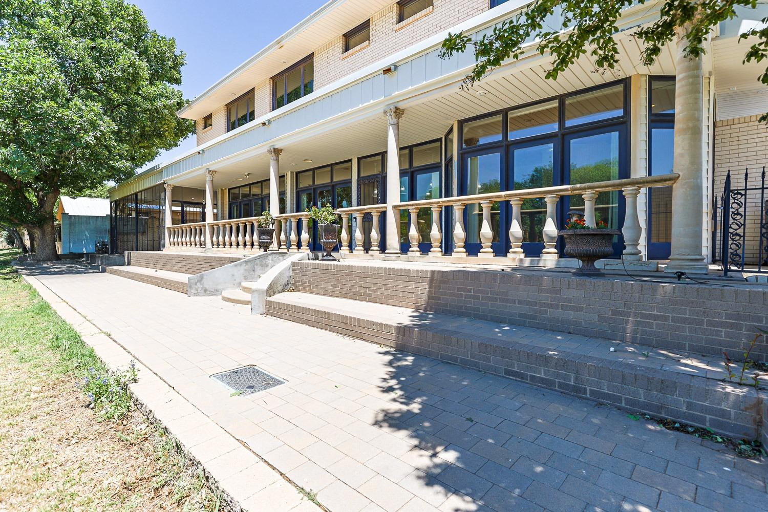 4603 94th Street Lubbock, TX 79424 - Photo 40 of 46 a front view of a house with a yard