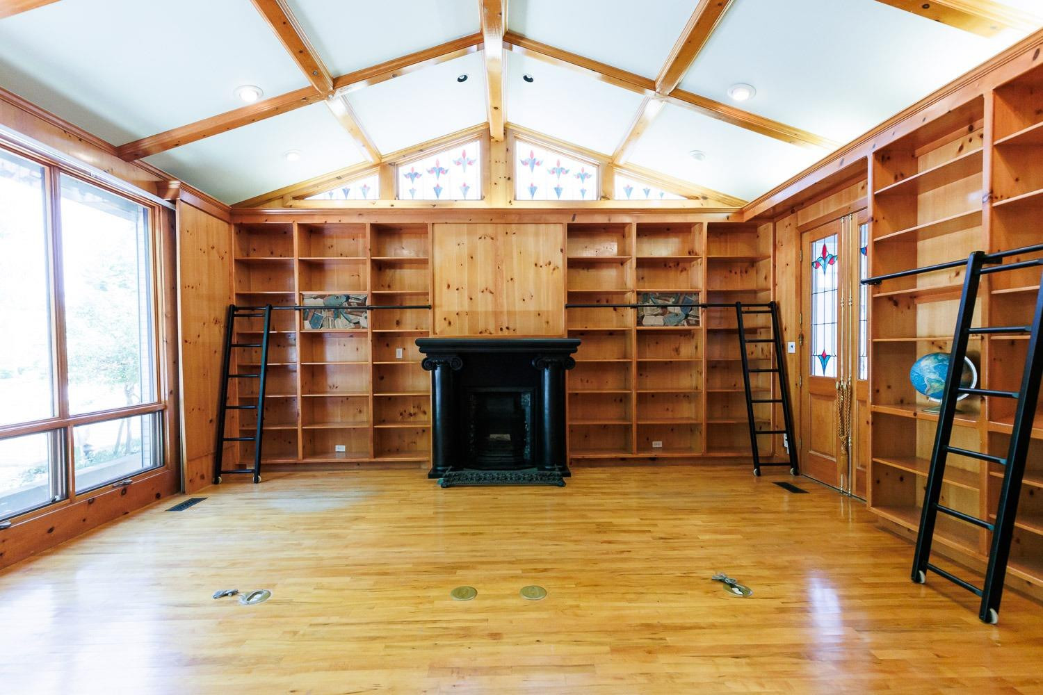 4603 94th Street Lubbock, TX 79424 - Photo 8 of 46 a view of an empty room with wooden floor and a window
