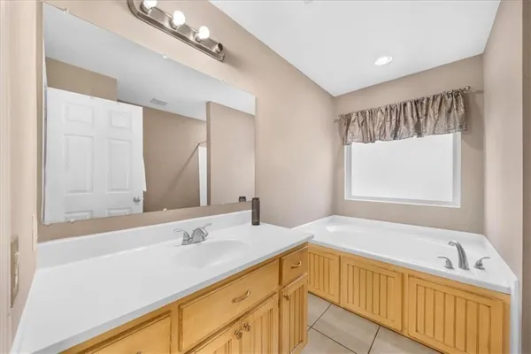 a bathroom with a bathtub and a sink