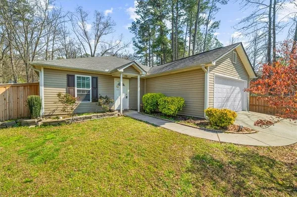 front view of a house with a yard