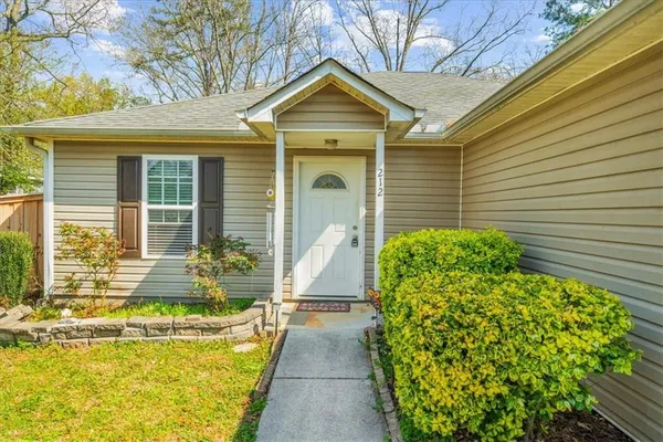 a front view of a house having yard
