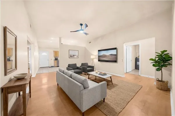 a living room with furniture and a flat screen tv