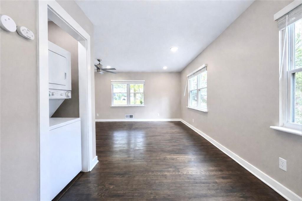 1291 Lorenzo Drive Southwest Atlanta, GA 30310 - Photo 8 of 20 a view of a big room with wooden floor and windows
