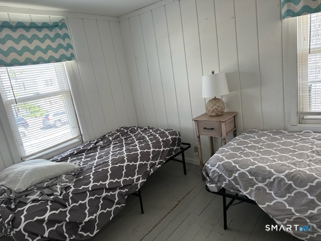 855 East Broadway Milford, CT 06460 - Photo 11 of 19 a bedroom with a bed and a window