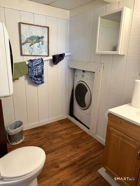 855 East Broadway Milford, CT 06460 - Photo 14 of 19 a bathroom with a toilet a sink and mirror