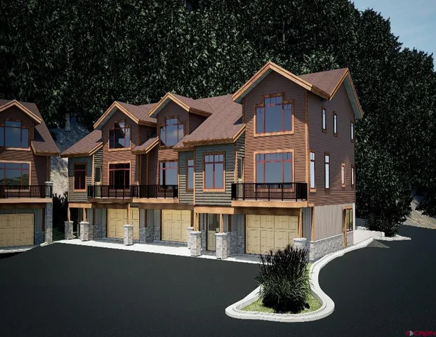 a front view of a house with a yard fire pit and outdoor seating