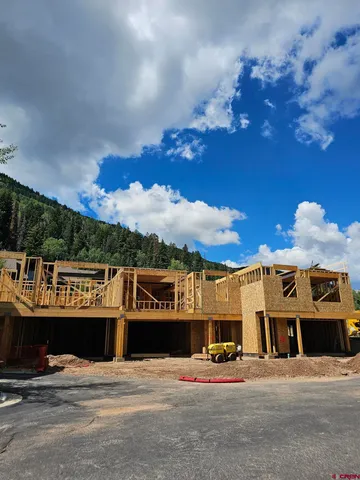 a view of a building with retail shops